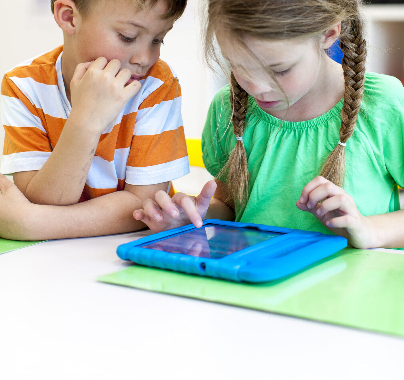 Pupils work with tablet in school in classroom